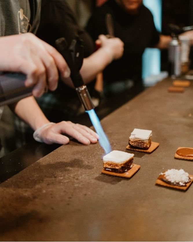 A s'more being torched to order at The Perfect Pear s'mores bar